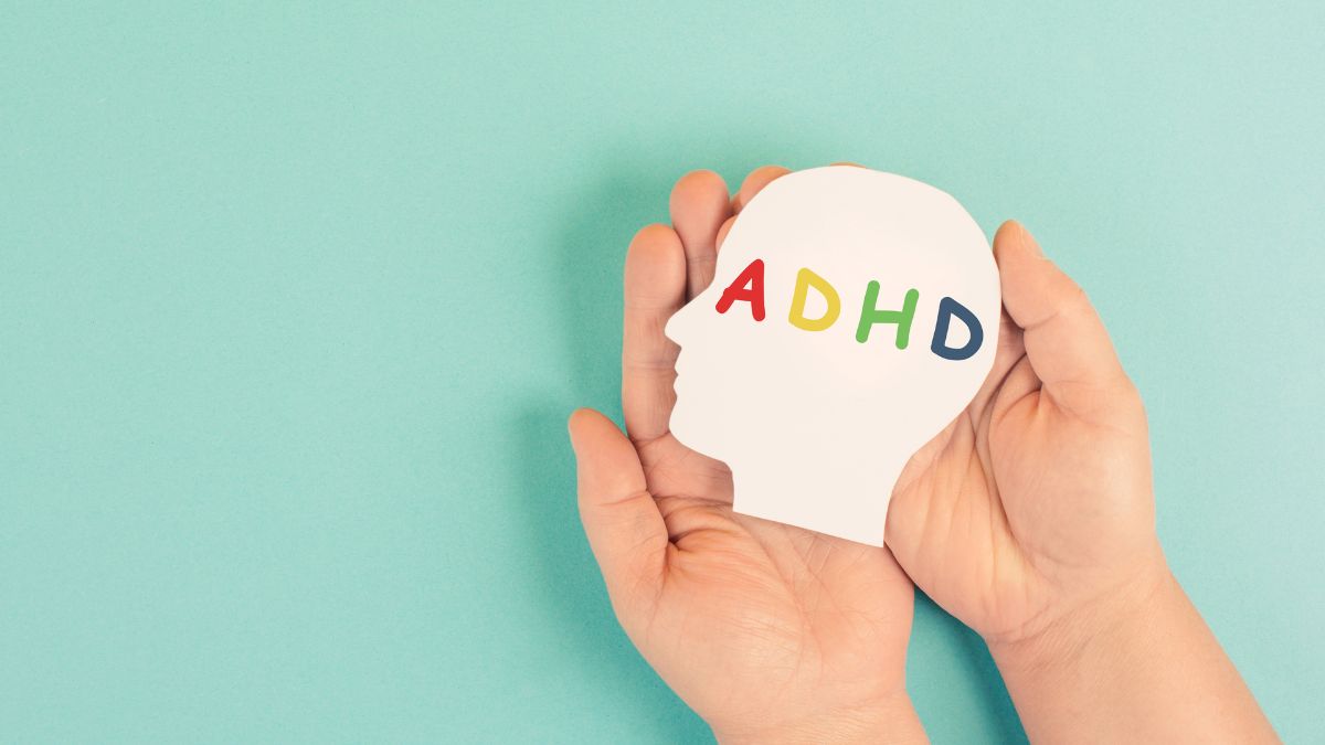 Hands Holding A Paper Head With Adhd Written On It