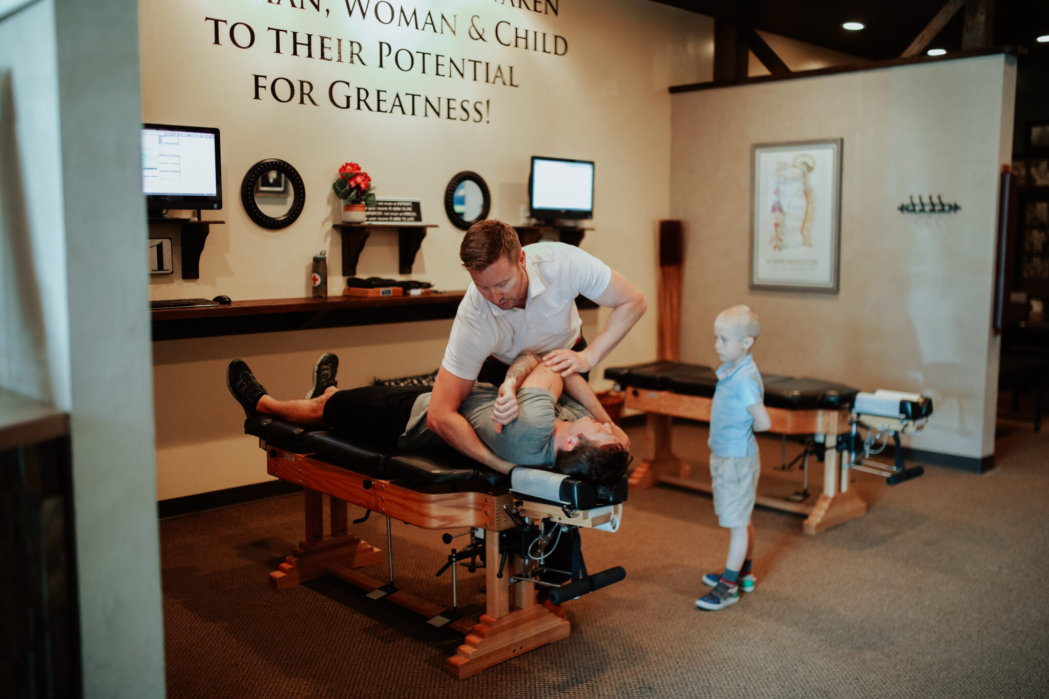 Chiropractor Adjusting A Person's Back