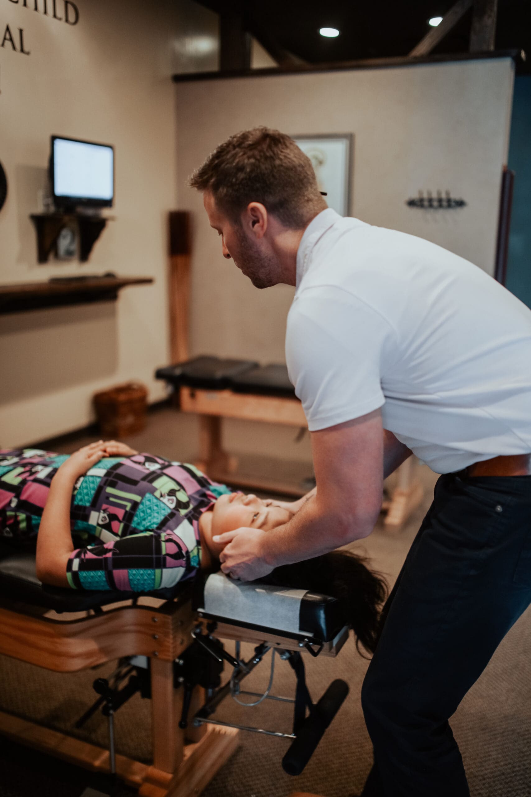 Chiropractor Adjusting Patients Neck